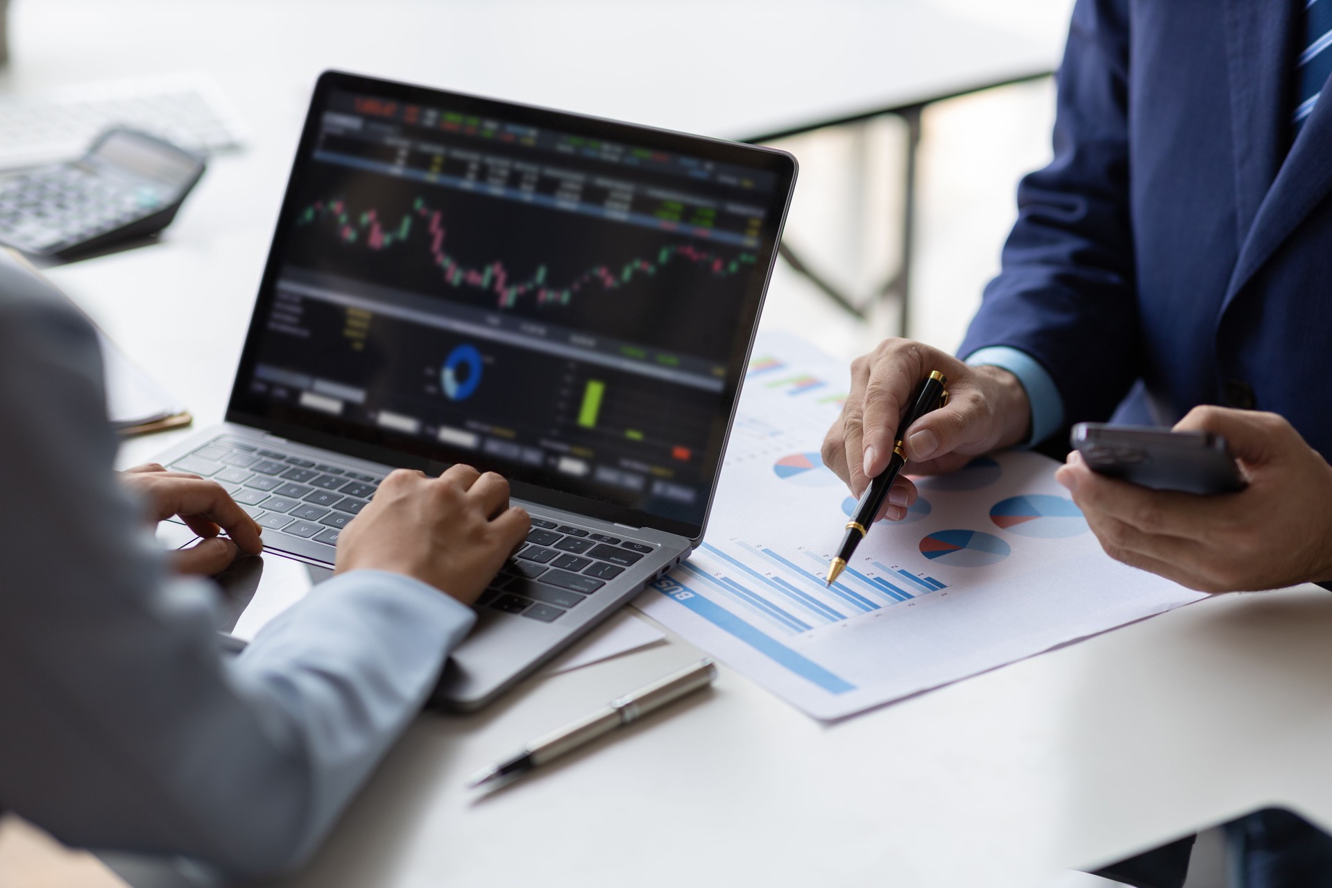 Business adviser meeting to analyze and discuss the situation on the financial report in the meeting room. Investment Consultant, Financial Consultant, Financial advisor and accounting concept.